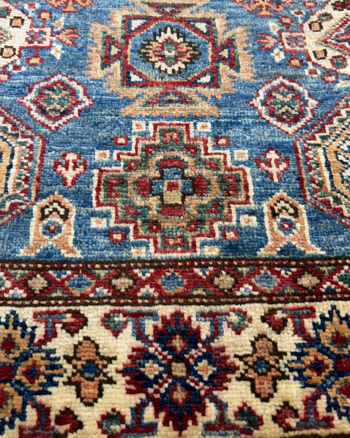 Tappeto Kazak 150x98 cm blu con medaglioni geometrici policromi