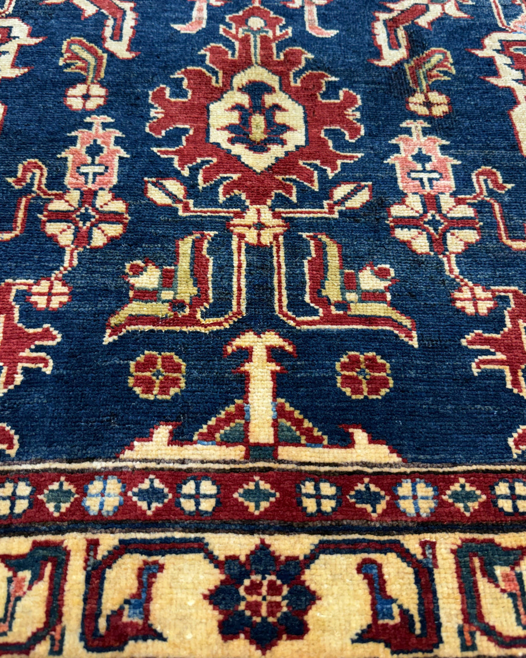 Tappeto Uzbek 160x98 cm blu con motivi geometrici rossi e crema