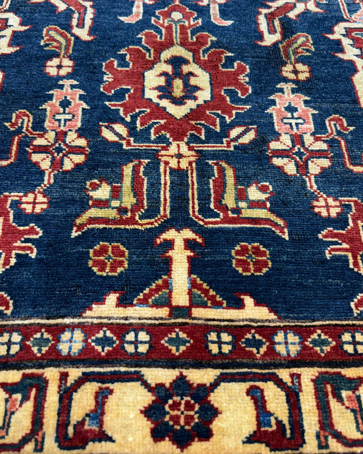 Tappeto Uzbek 160x98 cm blu con motivi geometrici rossi e crema