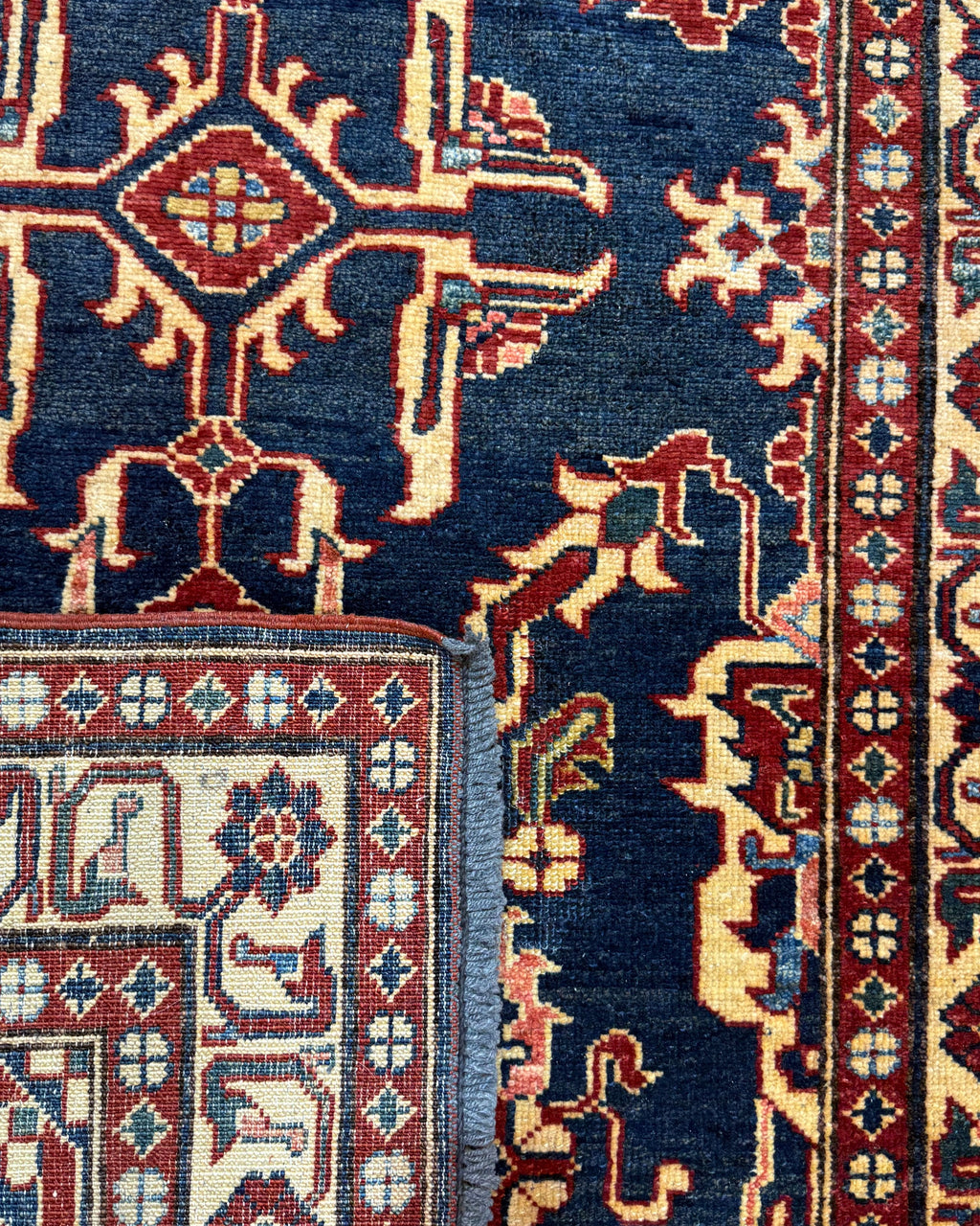 Tappeto Uzbek 160x98 cm blu con motivi geometrici rossi e crema