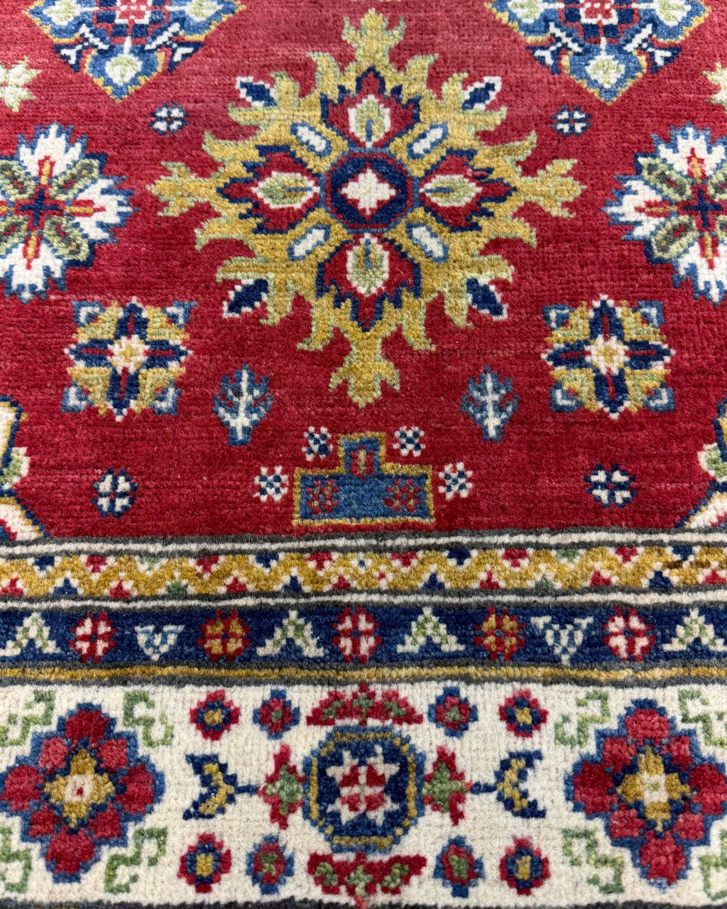 Tappeto Uzbek 149x98 cm rosso con medaglione geometrico centrale