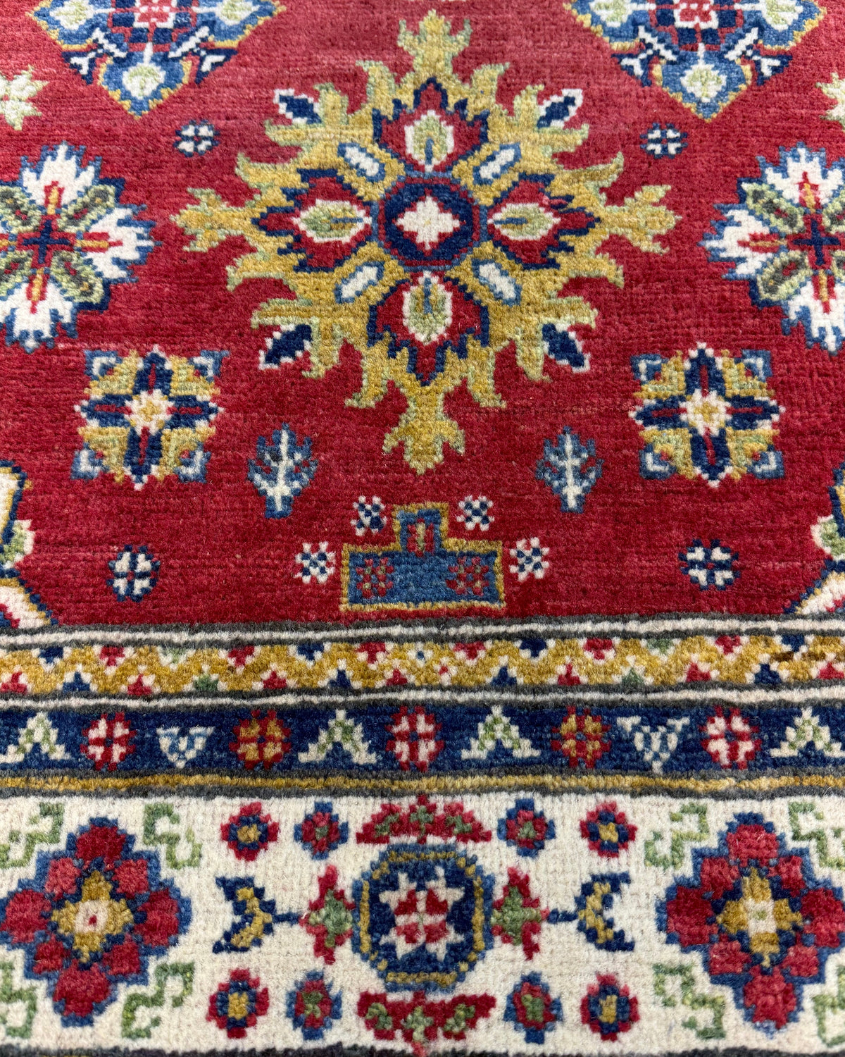 Tappeto Uzbek 149x98 cm rosso con medaglione geometrico centrale