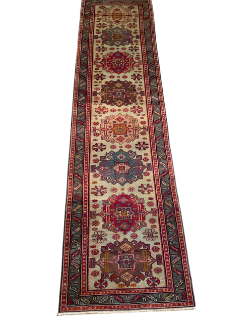 Passatoia azera usata 306x80 cm con medaglioni geometrici policromi su fondo avorio