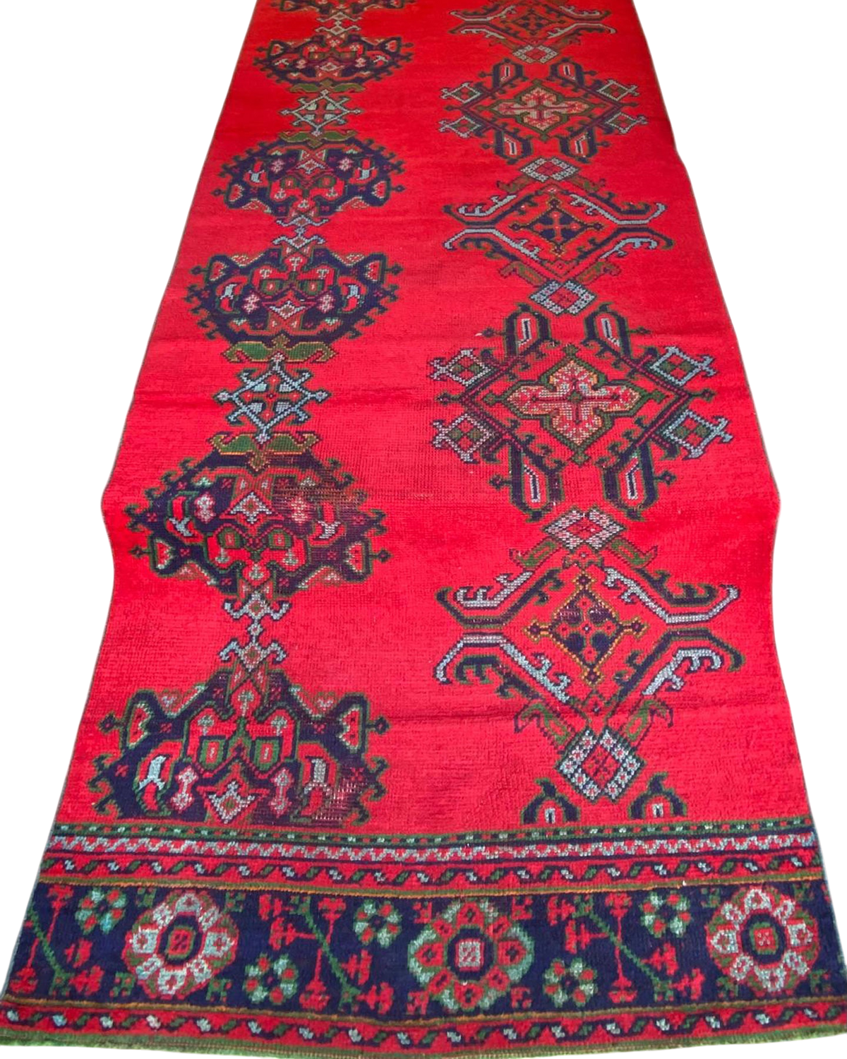 Passatoia turca usata 330x114 cm annodata a mano con fondo rosso e motivi geometrici