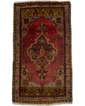 Tappeto Anatolia usato 105x60 cm con campo rosso e motivi geometrici tradizionali