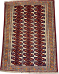 Tappeto Bukhara persiano usato 113x85 cm annodato a mano con motivi geometrici rossi, avorio e scuri