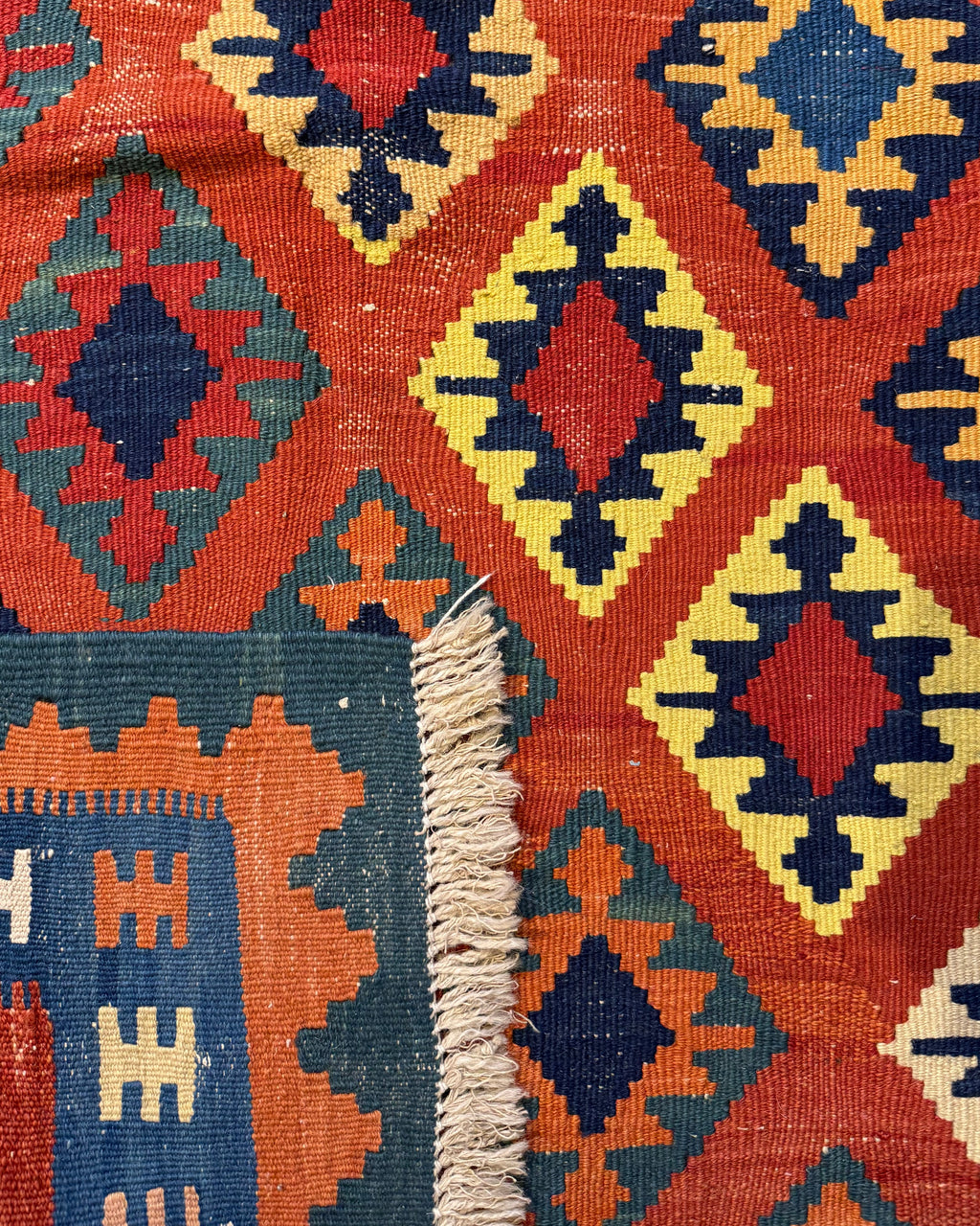 Dettaglio del retro del tappeto Kilim Persiano arancio 140x95 cm