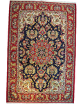 Tappeto Qom persiano annodato a mano con fondo blu notte, medaglione centrale e ricchi motivi floreali, misura 214x144 cm