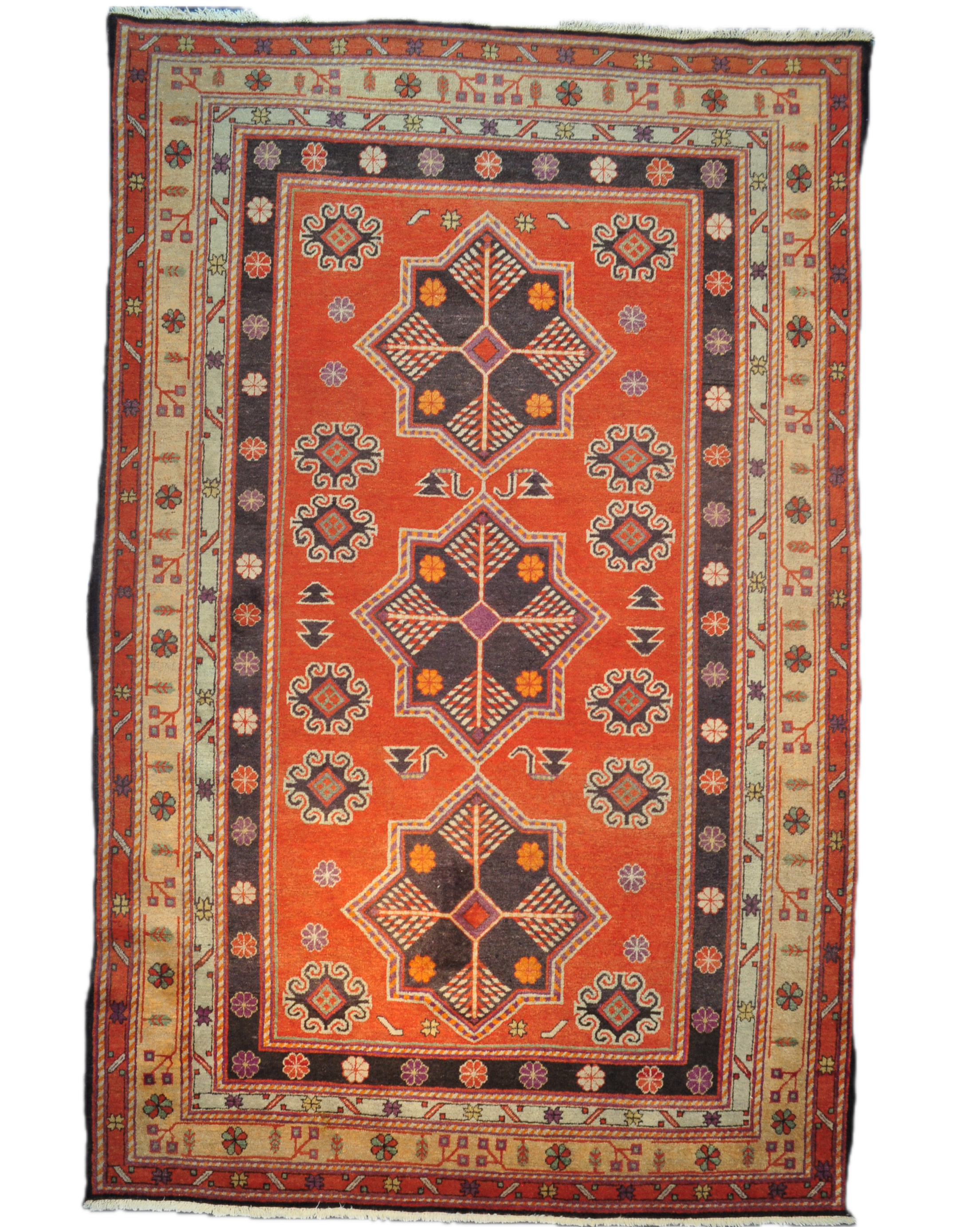 Tappeto Samarkanda annodato a mano con fondo terracotta e grandi motivi geometrici ispirati alla Via della Seta, misura 255x160 cm