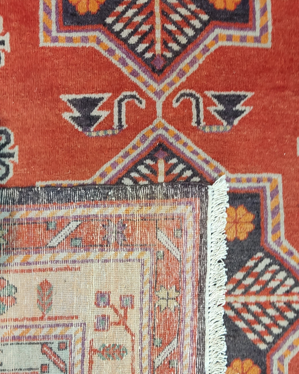 Tappeto Samarkanda annodato a mano con fondo terracotta e grandi motivi geometrici ispirati alla Via della Seta, misura 255x160 cm