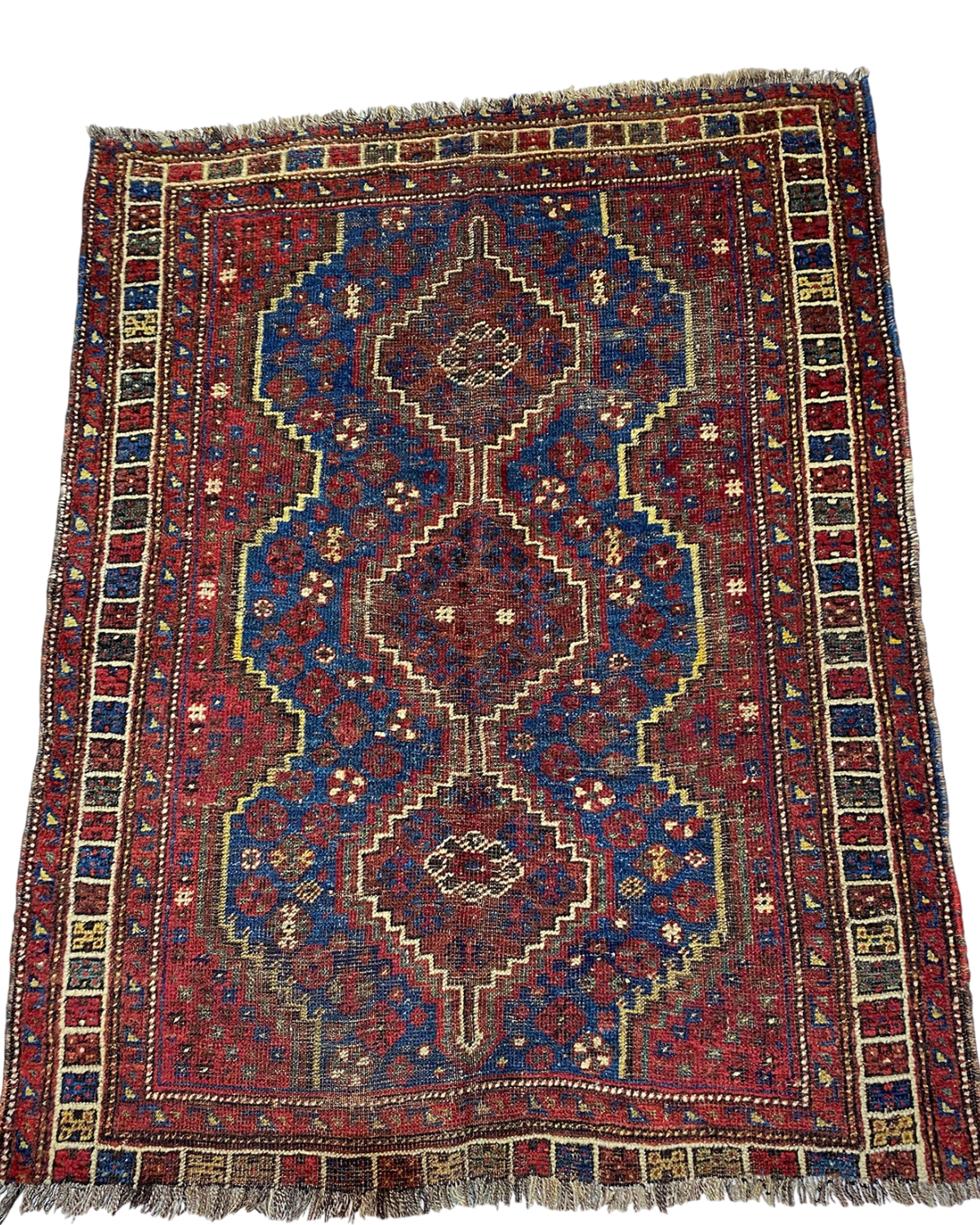 Tappeto persiano Shiraz usato 140x110 cm annodato a mano con tre medaglioni geometrici nei toni del rosso e blu