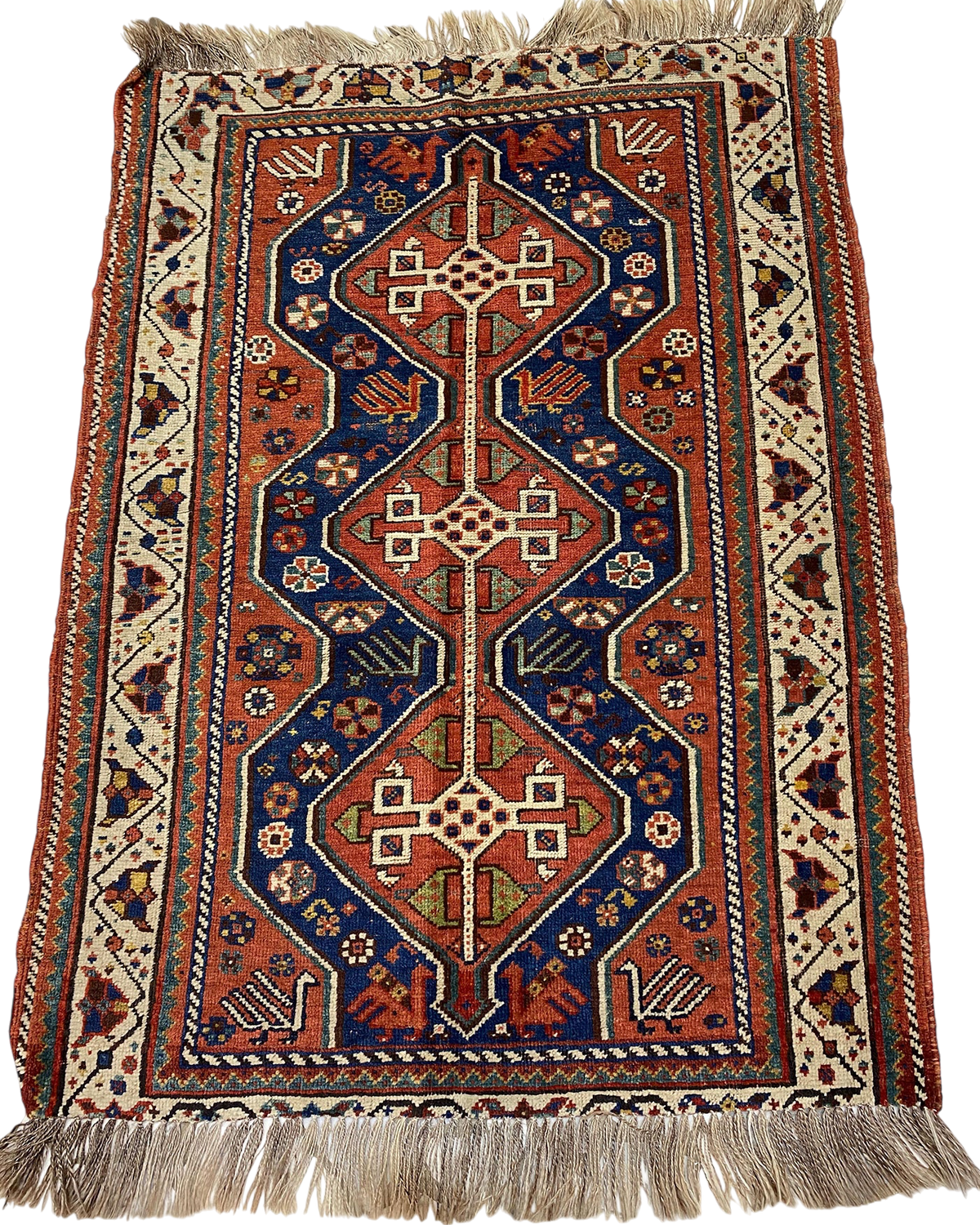 Tappeto persiano Shiraz usato 143x110 cm annodato a mano con tre medaglioni geometrici nei toni del blu e terracotta