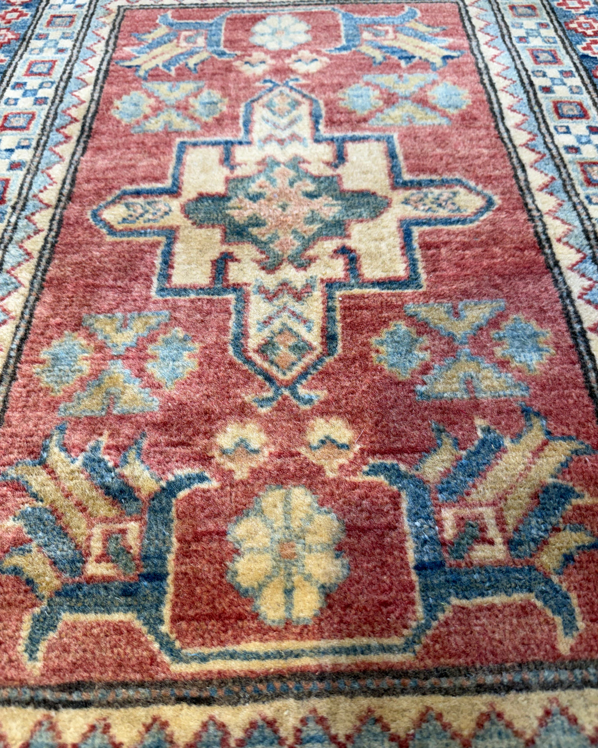Coppia di scendiletto Uzbek 92x65 cm con motivi geometrici nei toni del rosso, blu e beige