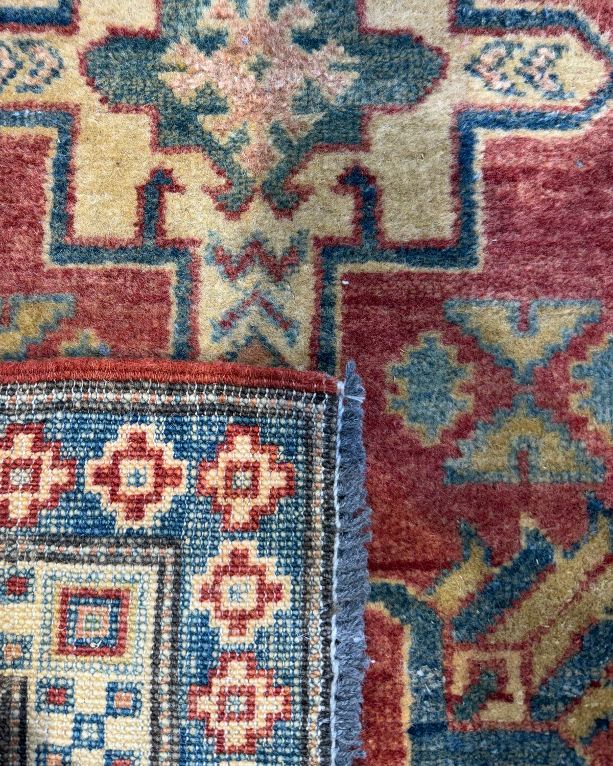 Coppia di scendiletto Uzbek 92x65 cm con motivi geometrici nei toni del rosso, blu e beige